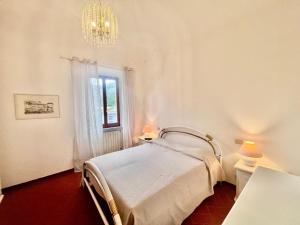 En eller flere senge i et værelse på Villino Rita