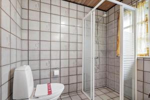 a bathroom with a toilet and a glass shower at 930-Thisted-Liusborg-Sti-28 in Torsted