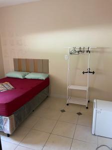 En eller flere senge i et værelse på Quartos Privativos Stella Maris