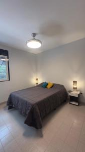 En eller flere senge i et værelse på Departamento entero Lumará