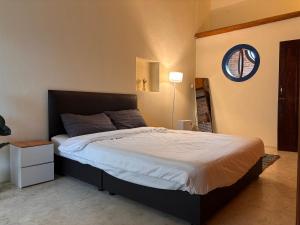 a bedroom with a large bed and a window at The Canopy house Private cozy stay Pai Mountains in Pai