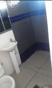 a bathroom with a sink and a toilet at Casa em Itapucu SC a 200mts do trapiche in Araquari