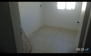 a white room with a door and a window at Casa em Itapucu SC a 200mts do trapiche in Araquari +1 photo
