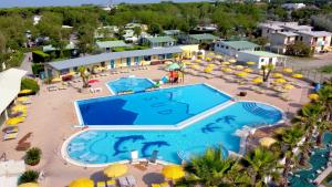 an aerial view of a resort with a swimming pool at Villa Serena in Rosolina Mare