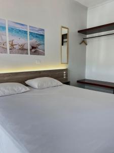 Postel nebo postele na pokoji v ubytování Aldeia Da Lagoinha