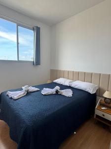 En eller flere senge i et værelse på Apto 403 - 500 metros da Praia