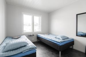 Giường trong phòng chung tại Kippari