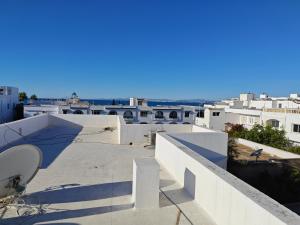 a view of the roofs of white buildings at App corniche hammamet in Hammamet