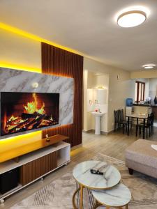 Телевизор и/или развлекательный центр в Casaroca Stylish 2br