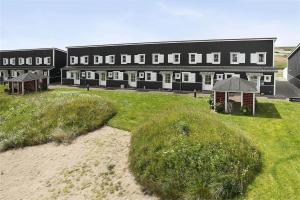 a large black building with grass in front of it at 266-Vestervig-Havnevej-1-lejl-19 in Vestervig