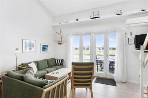 a living room with a couch and a table at 266-Vestervig-Havnevej-1-lejl-19 in Vestervig