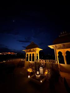 a wedding venue at night with a gazebo at Hotel Boheda Palace - 1KM away from Lake Pichola in Udaipur