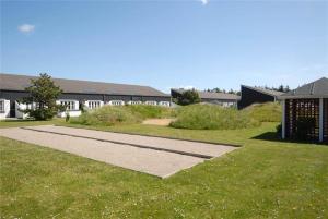 a walkway in the grass in front of a building at 254-Vestervig-Havnevej-1-lejl-4 in Vestervig