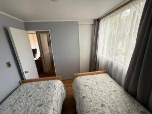 Postel nebo postele na pokoji v ubytování departamento diario Copiapó 3 + 4 fotografie