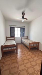 Postel nebo postele na pokoji v ubytování Ubatuba Sport House