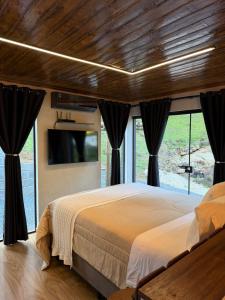 Ένα ή περισσότερα κρεβάτια σε δωμάτιο στο Hotel Fazenda Gabro - Vitra