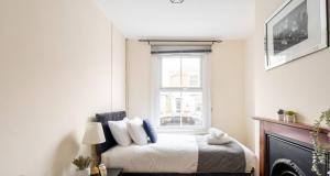 Ένα ή περισσότερα κρεβάτια σε δωμάτιο στο Reading retreat