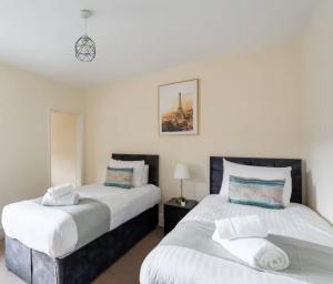 Ένα ή περισσότερα κρεβάτια σε δωμάτιο στο Reading retreat