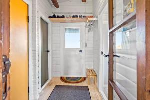 a tiny house hallway with a door and a rug at 309-Bedsted-Thy-Redningsvej-9 in Bedsted Thy