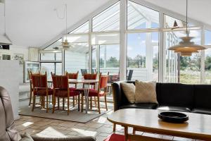 a living room with a table and chairs at 542-Thisted-Kuttervej-11 in Thisted