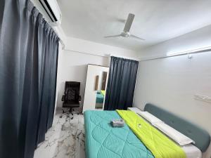 En eller flere senge i et værelse på Aura Prime Stays