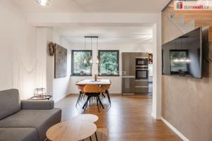 a living room with a couch and a table at Apartmány Fun & Relax Dolní Morava in Dolní Morava +40 photos