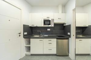 Kuchyň nebo kuchyňský kout v ubytování Las Flores studio 1