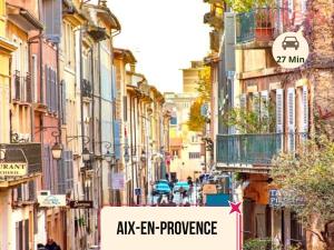 a city street with a sign that reads alken exchange at Le Fit and Chill - Confort & Calme - Parking - Proche Aéroport et Plage du Jaï in Marignane