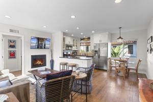 a kitchen and living room with a table and chairs at Hideaway ALL Walk to the Beach Downtown AC in San Clemente