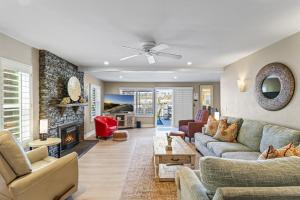 a living room with a couch and a fireplace at 4BR Beach Condo Kids Hideaway Walk to Beach Casino Ole Hanson in San Clemente