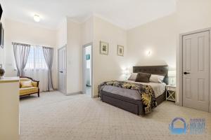 Ένα ή περισσότερα κρεβάτια σε δωμάτιο στο Townside Getaway in Mandurah