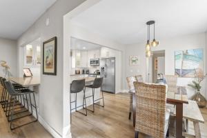 a kitchen and dining room with a table and chairs at Hideaway A Walk to the beach Downtown AC in San Clemente