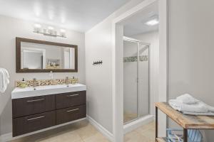a bathroom with a sink and a shower at Hideaway A Walk to the beach Downtown AC in San Clemente +28 photos
