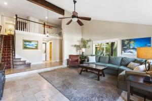 a living room with a couch and a ceiling fan at Tropical 2BR Retreat Walk to Beach Wedding Venues Large Deck in San Clemente