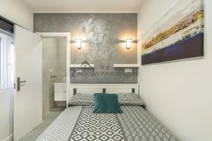 Postel nebo postele na pokoji v ubytování Las Flores studio 1