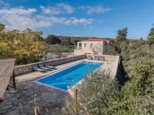 an image of a swimming pool in a villa at Vamos villa in Vamos