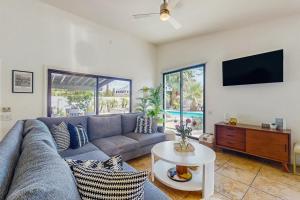 a living room with a couch and a tv at Jewel of the Desert 259-342 in La Quinta