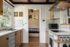 a kitchen with a sink and a stove at 1344-Vestervig-Hedevej-43 in Vestervig