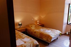 Ένα ή περισσότερα κρεβάτια σε δωμάτιο στο Presbytere