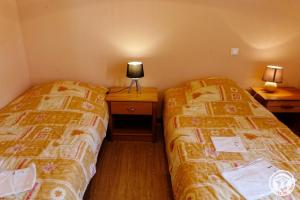 Ένα ή περισσότερα κρεβάτια σε δωμάτιο στο Presbytere