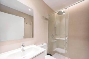 a bathroom with a sink and a glass shower at Stancia Benimaclet - Studio 11 in Valencia