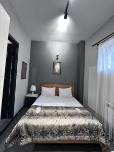 En eller flere senge i et værelse på Heritage Old City Hotel