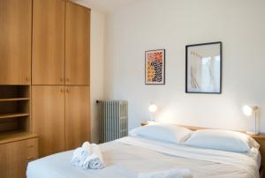 Ένα ή περισσότερα κρεβάτια σε δωμάτιο στο Garden - residence in the center of Barzio