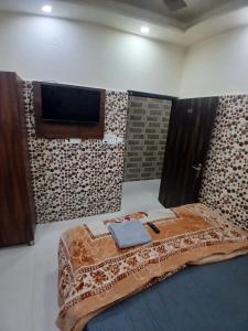 Postel nebo postele na pokoji v ubytování Agam homestay- Few steps walk From Golden Temple + 16 fotografií