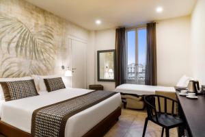 a hotel room with two beds and a desk at Best Western Plus Royal Superga Hotel in Cuneo +83 photos