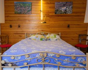 Un pat sau paturi într-o cameră la Au Cœur Du Pays Cathare