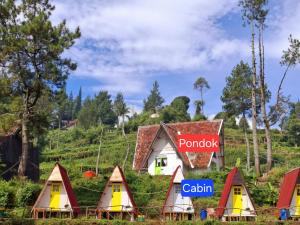 a group of tents in front of a house at Aubrey Villa Ciwidey in Pengalengan +6 photos