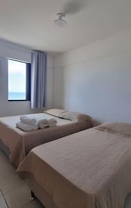 Ένα ή περισσότερα κρεβάτια σε δωμάτιο στο Lindo Apartamento Vista para o Mar. (2 quartos)