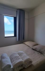 En eller flere senge i et værelse på Apartamento Vista para o Mar. (2 quartos) + 55 billeder