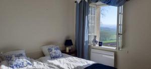 Postel nebo postele na pokoji v ubytování Chambre des Remparts